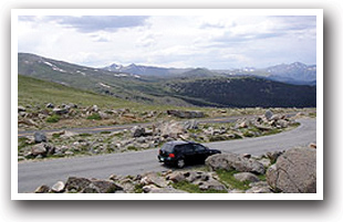 Car driving along the Pikes Peak Scenic Drive, Colorado.