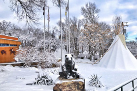 Ute Indian Museum with teepee covered in snow in the winter. Located in Montrose, Colorado.